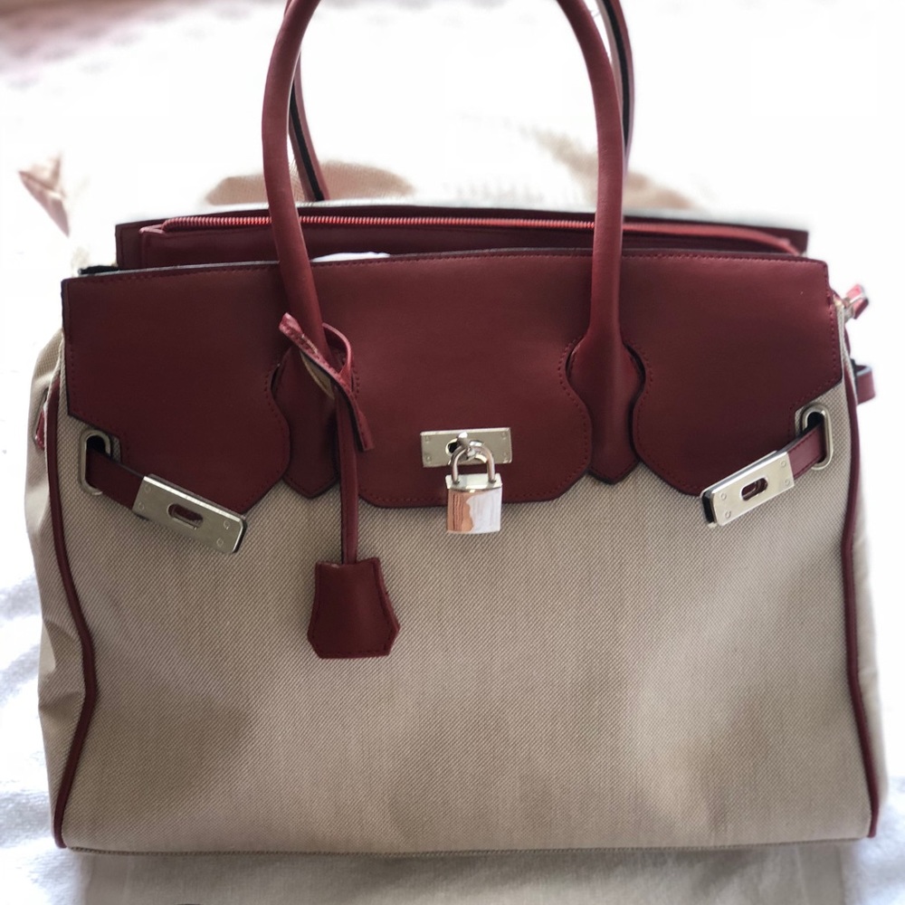 Beautiful genuine leather top handle bag.